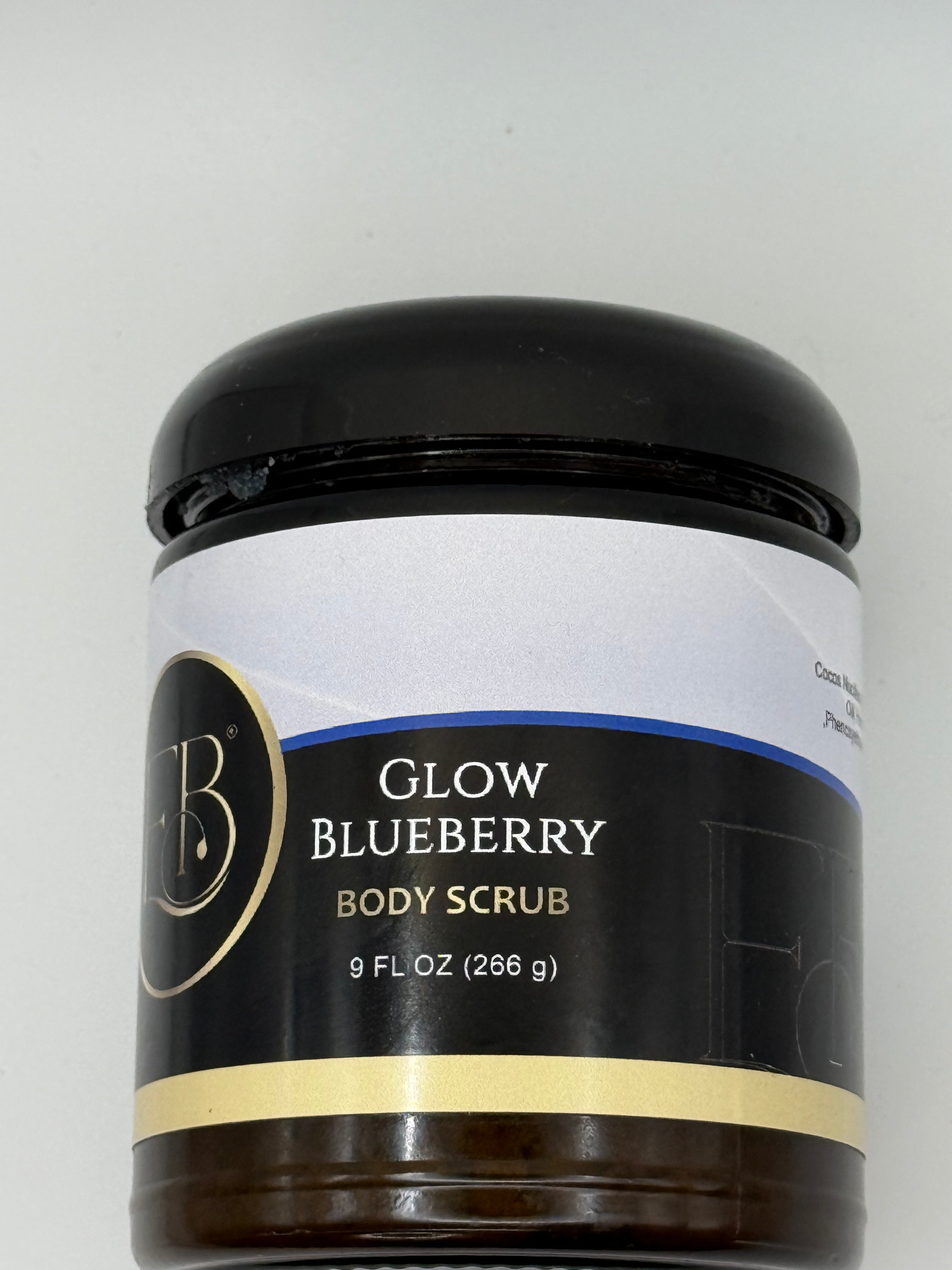 Jar of Glow Blueberry Body Scrub on a light gray background
